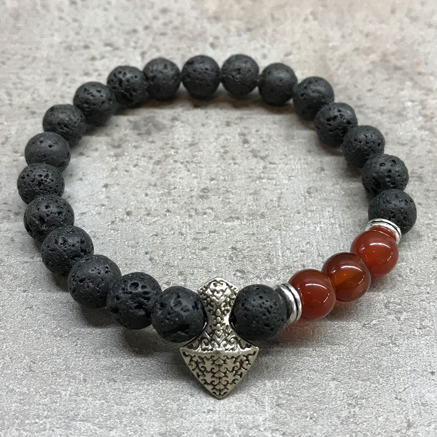 bG9jYWw6Ly9tZWRpYS8xRy9KQy82MFIzMEMxRzZNVDNKQzFHL2M4NGNkMzM4LmpwZWc.jpg Lava Stone Bracelet - Axe-head Carnelian - Image 2